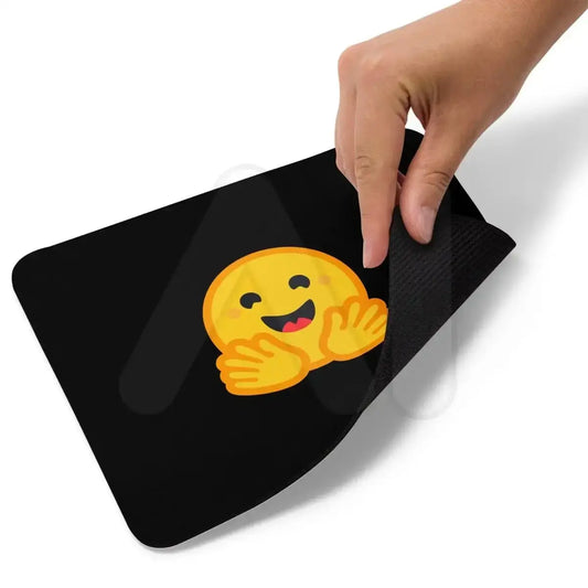 The Black Hugging Face Icon Mouse Pad.